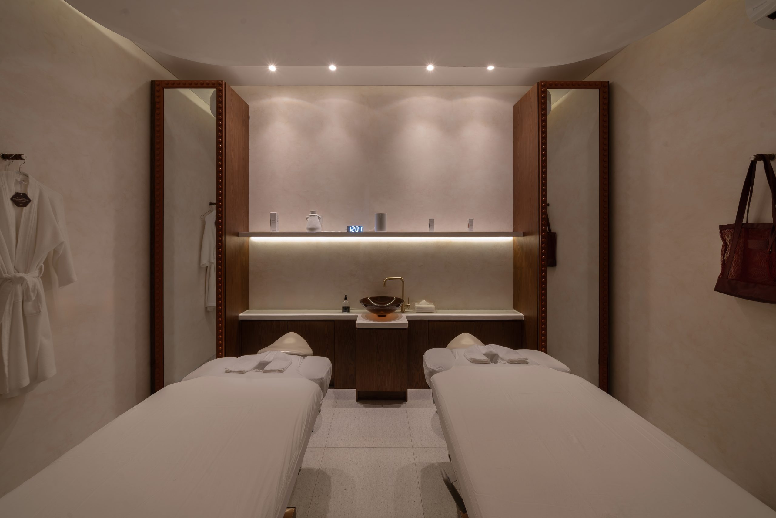Twin treatment room at Mello Spa Canggu set up for two, with robes and a shared vanity