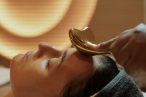 Facial treatment in serene Mello Spa room with soft lighting and luxury skincare products