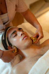 Copper Gua Sha tool and essential oils used to enhance massage experience at Mello Spa